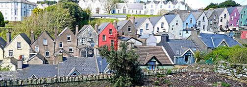 A row of houses ascends a hill in Cobh
